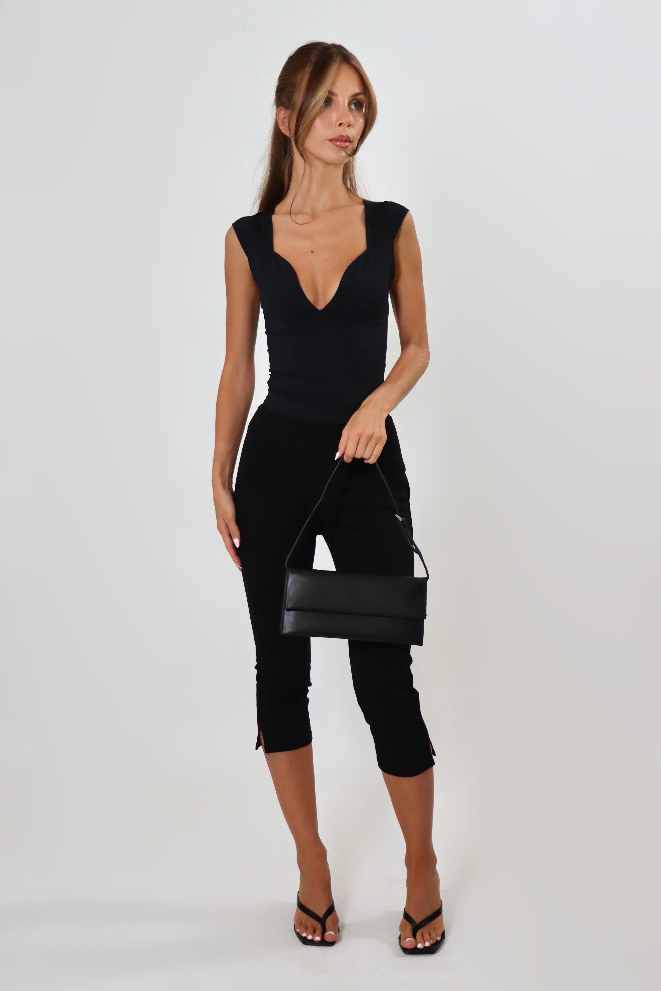 April Seven Beverly Top in black – sculpted fitted top with plunging neckline, cap sleeves, and contoured design.