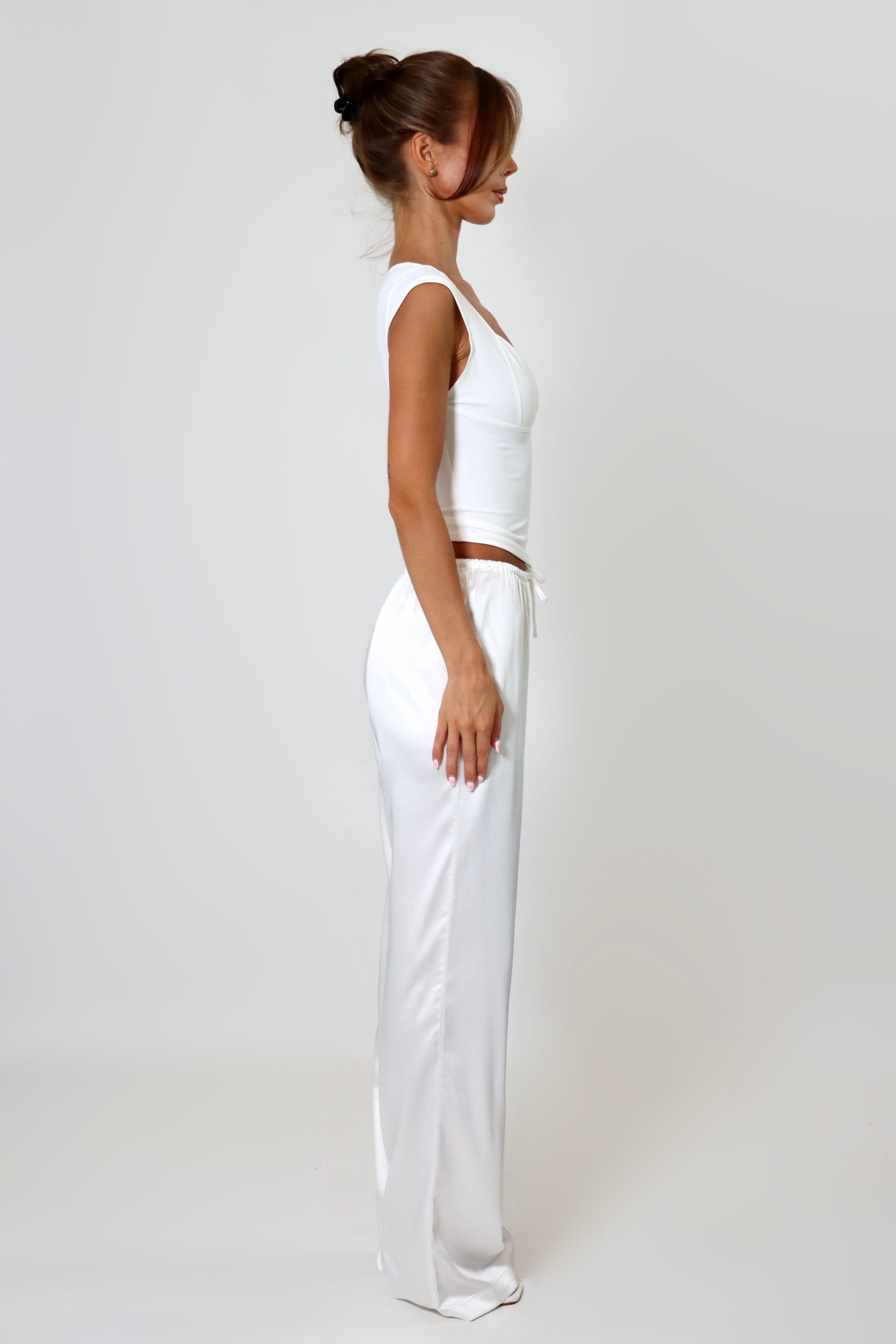 April Seven Beverly Top in white – minimalist fitted top with plunging neckline, cap sleeves, and sculpted silhouette.