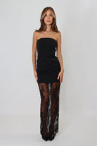 April Seven black strapless maxi dress with lace bottom – elegant floor-length silhouette.